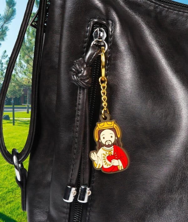 Jesus keychain on a bag in a park