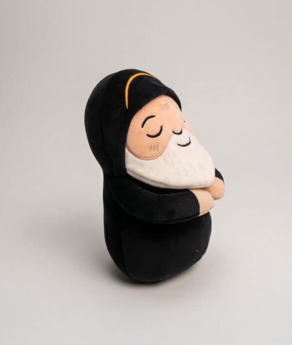 Side view of the Saint Charbel plushie