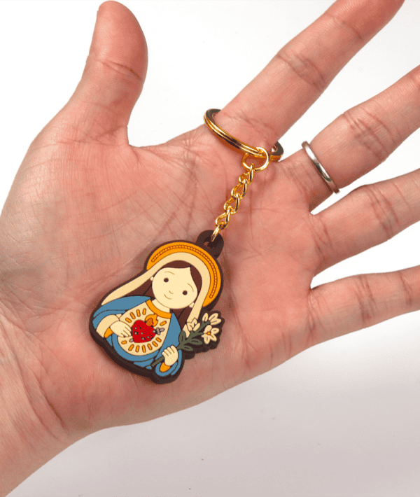 Mary Keychain on a hand for size comparison