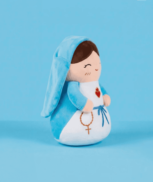 Side view of the Virgin Mary plush toy