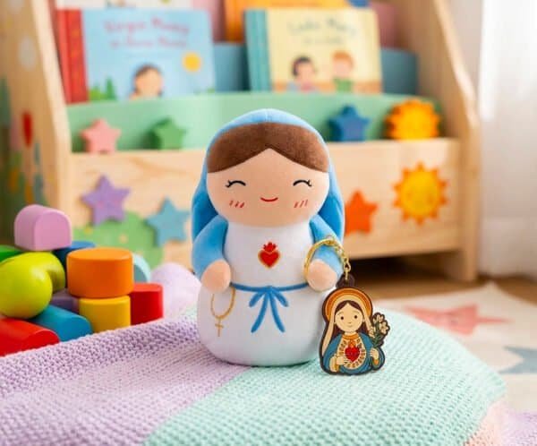 Virgin Mary plush toy and matching keychain on the floor of a child's room