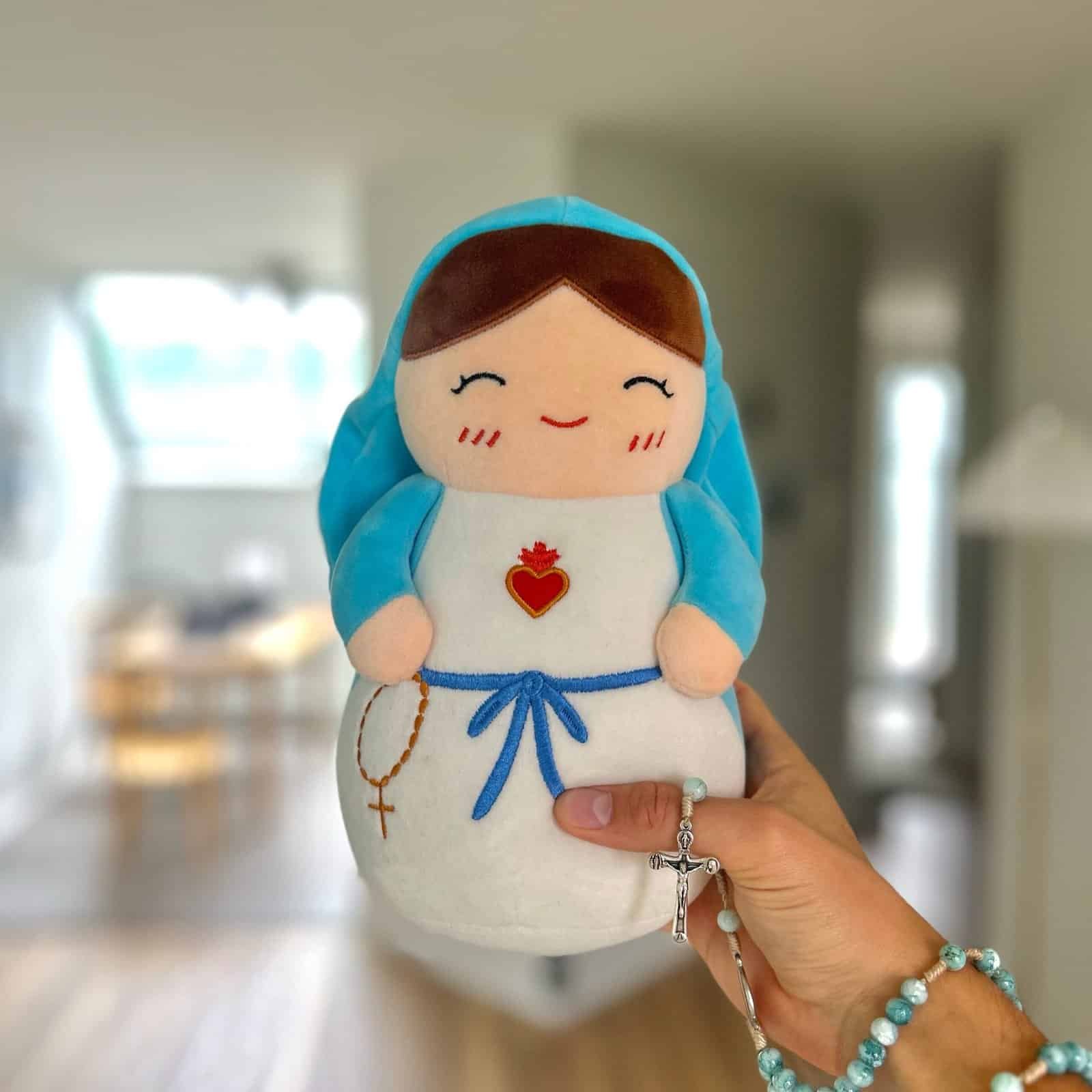 Mary Prayer Plushie held in a hand, about 10 inches tall